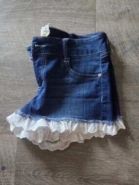 Altar'd State Dark Blue Denim Shorts with White Eyelet Lace Trim.